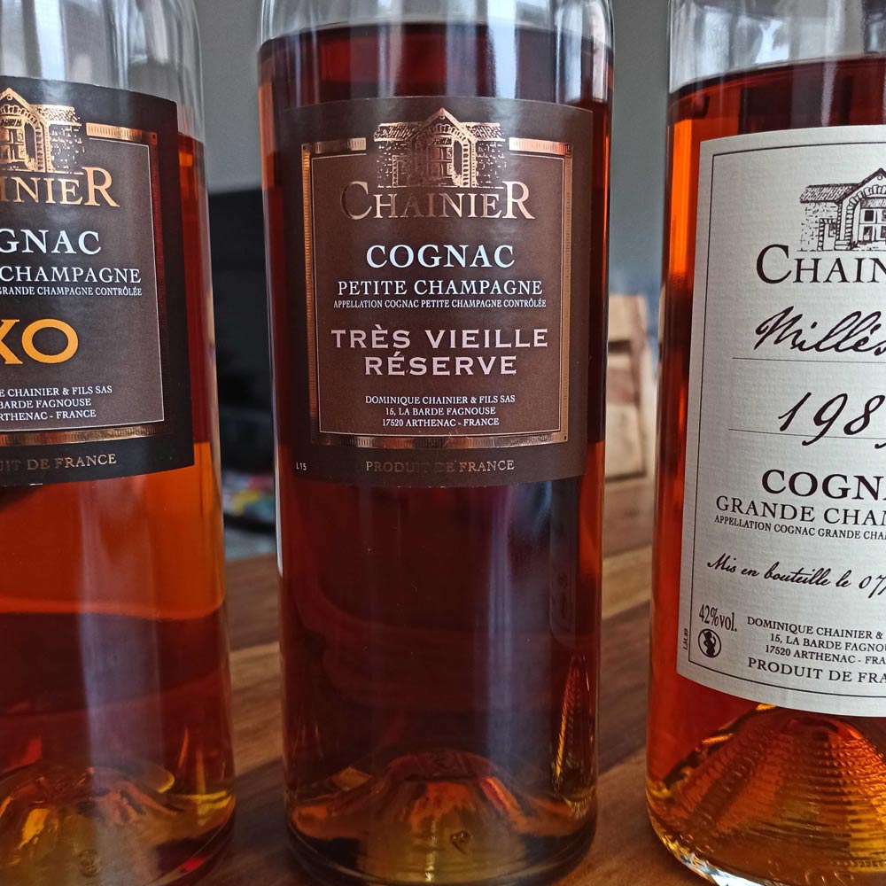 3 Chainier Cognac bottles next to each other