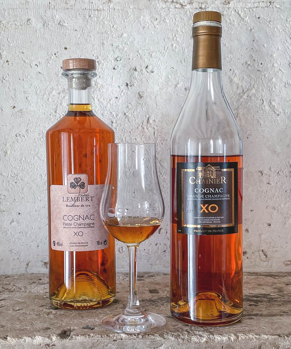Lembert Xo and Chainier XO bottles with cognac glass