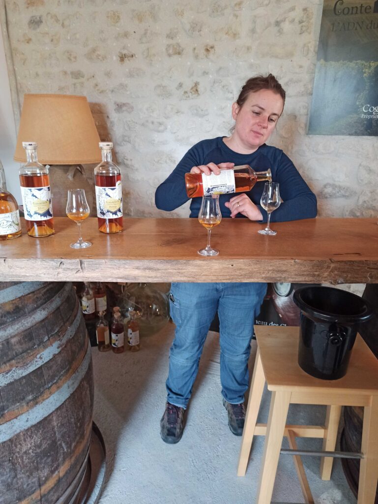 Anne-Laure from Conte et Filles Cognac pouring a glass of Cognac