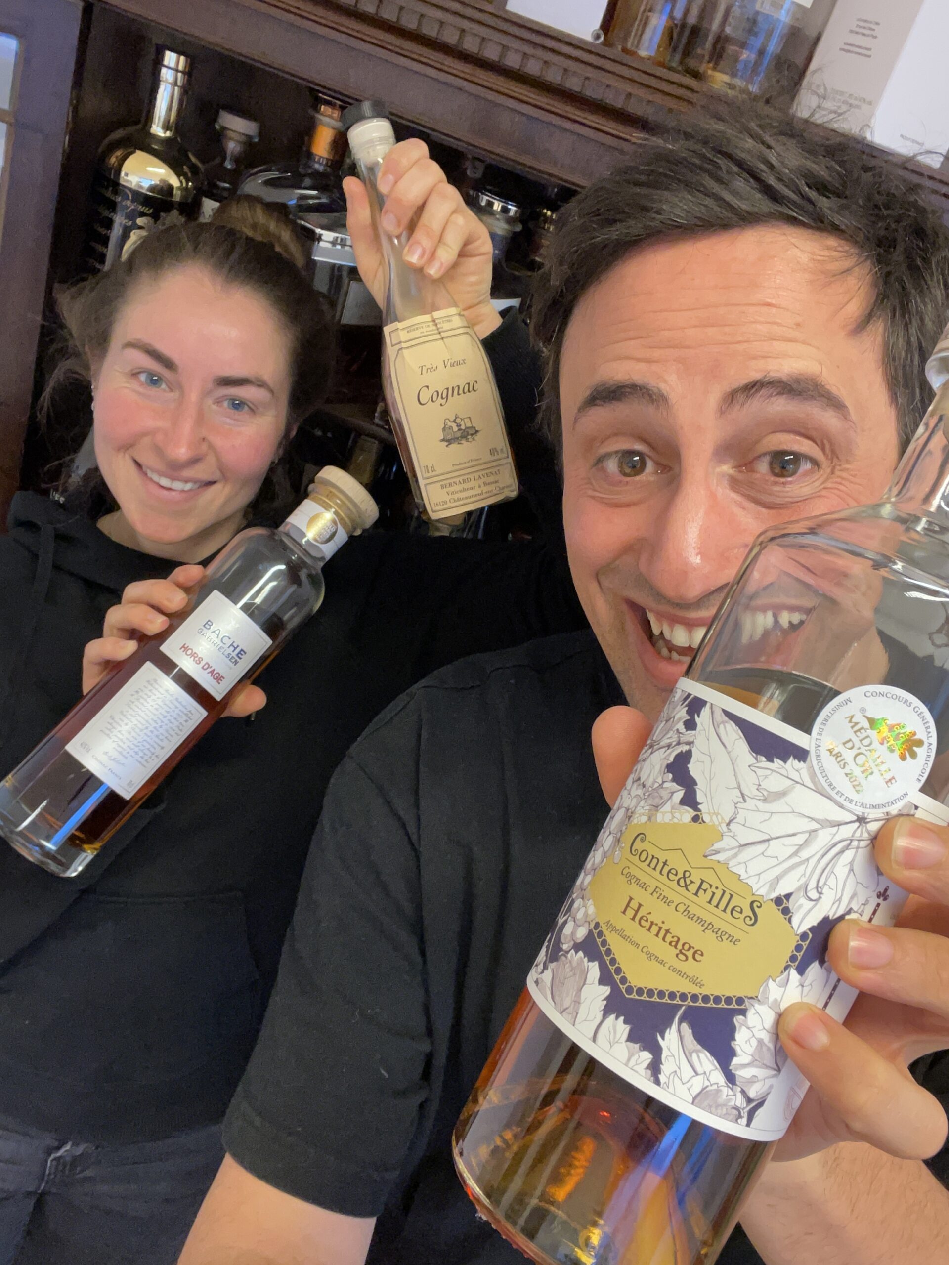 Virginia and Max holding the top 3 winners up of the Cognac Tasting